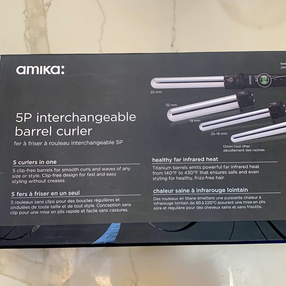 Amika interchangeable 5p barrel curler. Lightly used still in box.